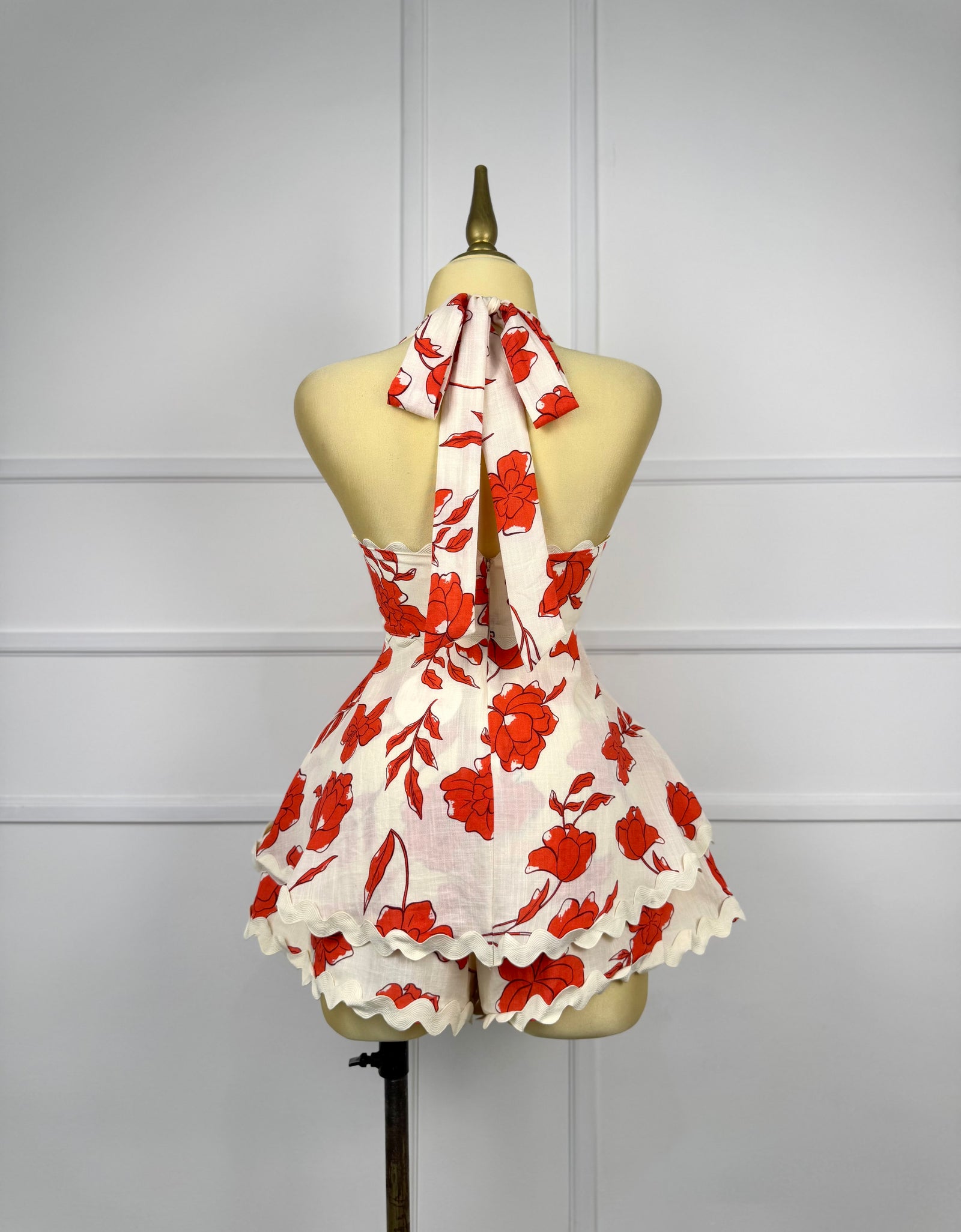 Jumper beige con flores rojas
