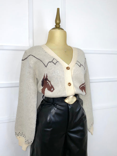 Suéter tejido con caballos