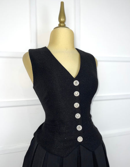 Vestido negro afelpado con plisado