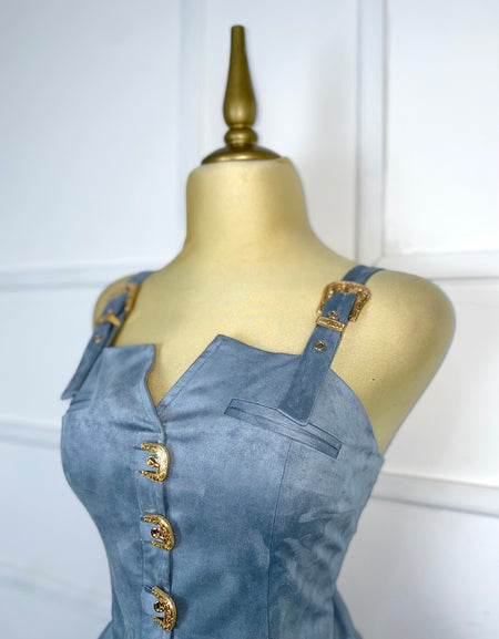 Blusa azul gamuza con hebillas