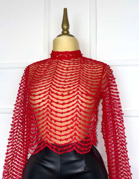 Blusa roja con perlas