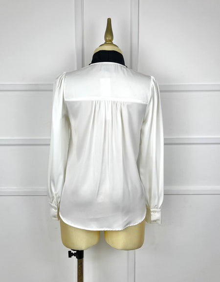 Blusa blanca con negro