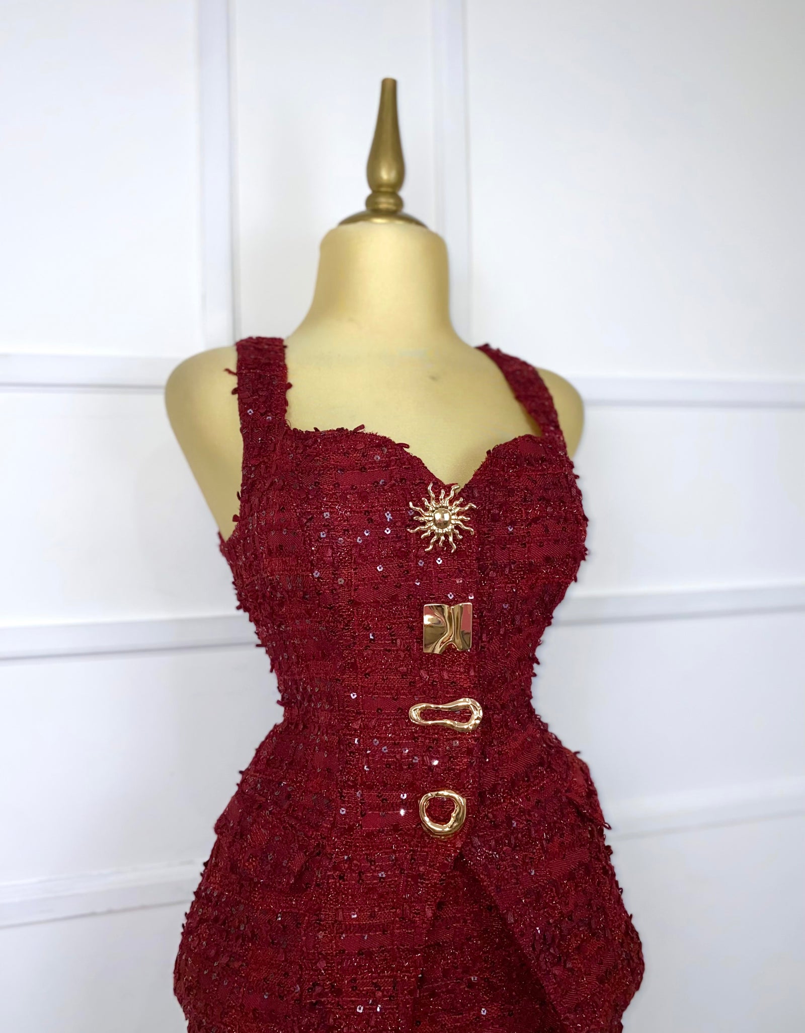 Set tinto tweed con botones dorados