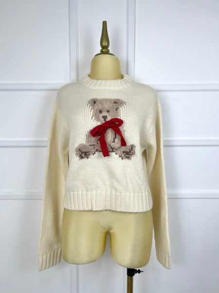 Suéter beige tejido con oso