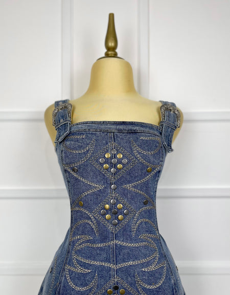 Jumper azul de mezclilla con hebillas