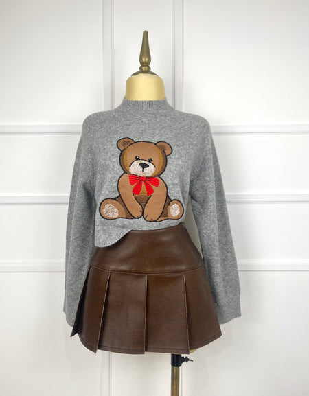 Suéter gris con osito