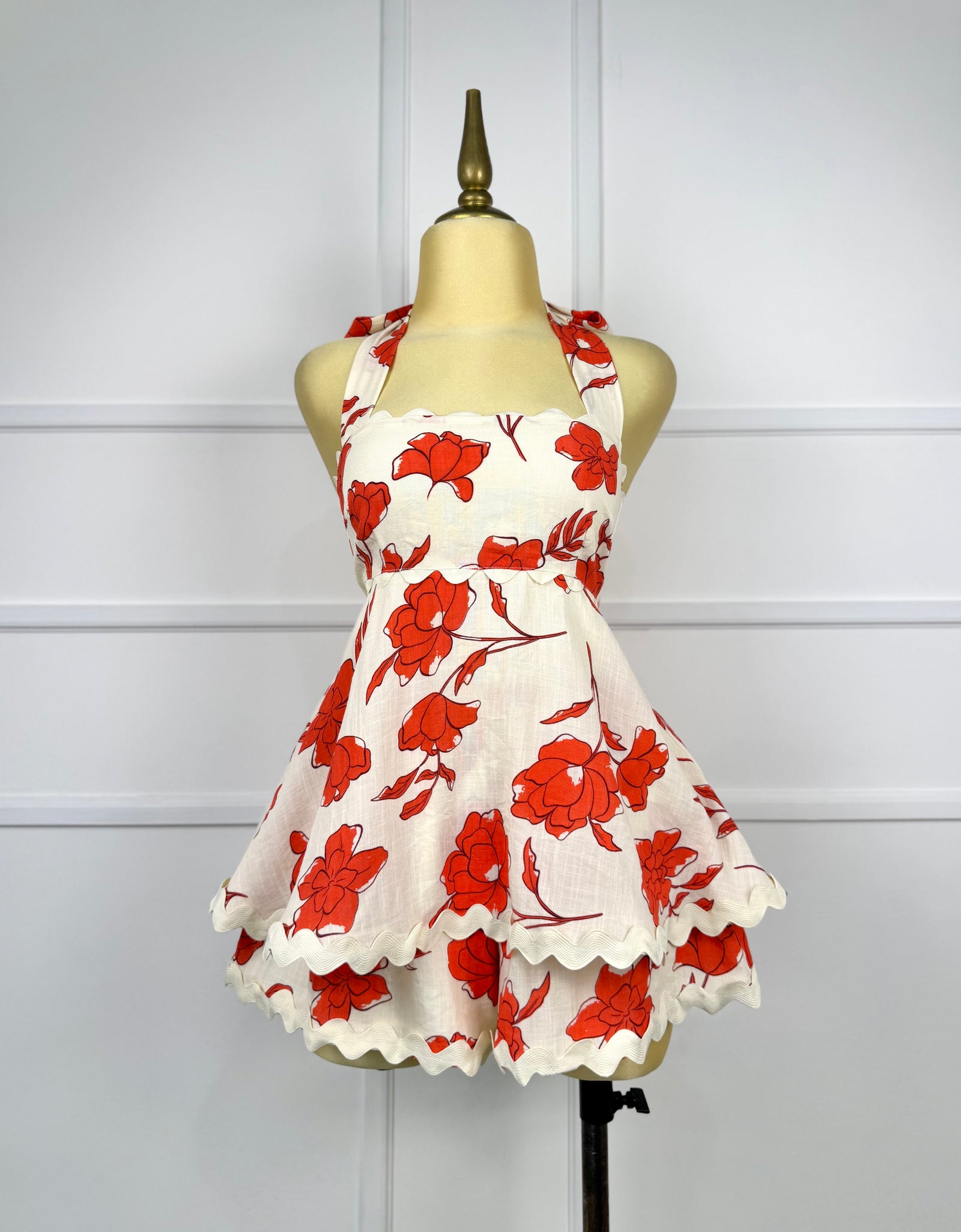 Jumper beige con flores rojas