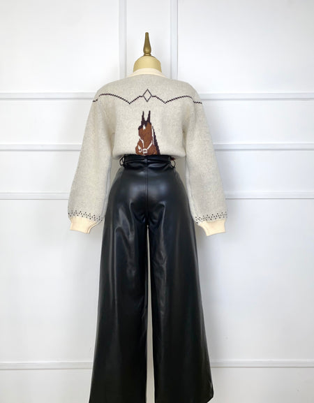 Suéter tejido con caballos