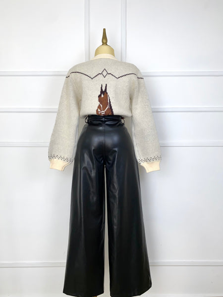 Suéter tejido con caballos