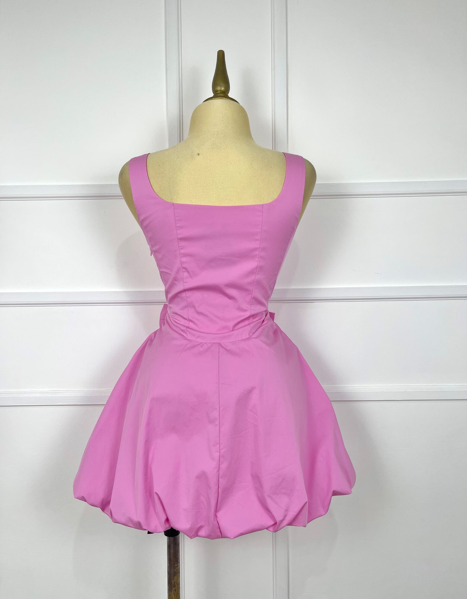 Vestido rosa bombacho con 2 moñitos